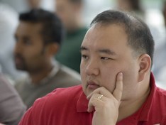 Undergraduate Student Listening to Professor