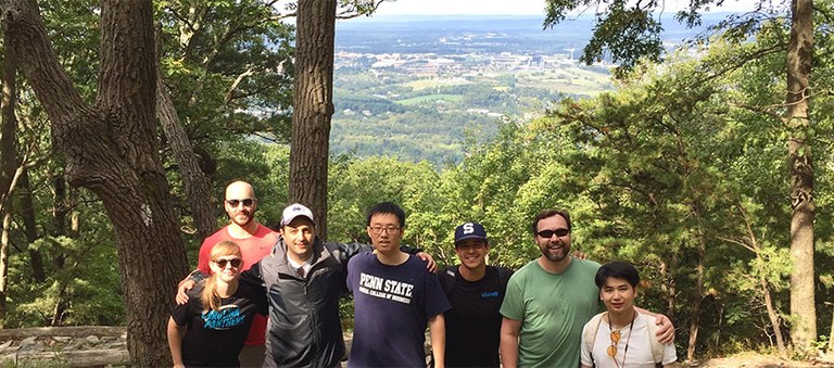Graduate students, friends, family and staff on Mount Nittany during Lion Weekend